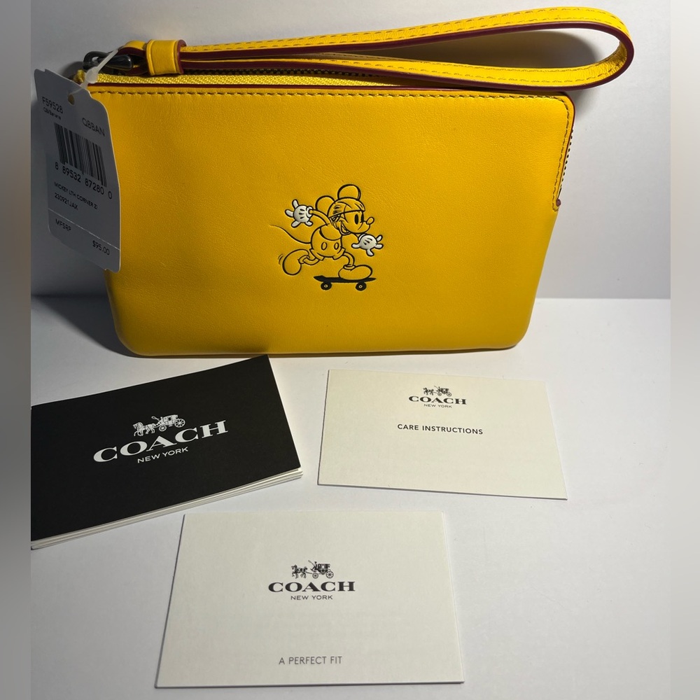 COACH x Disney Mickey Mouse on skateboard yellow corner zip leather wristlet NWT